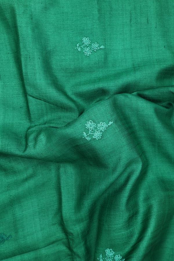 Tussar Silk Saree In Green With Floral Embroidered Buttas