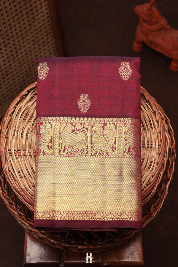 Kanchipuram Silk Saree In Dark Maroon With Parrot Buttas
