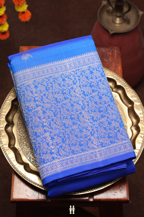 Kanchipuram Silk Saree In Indigo Blue With Parrot Buttas