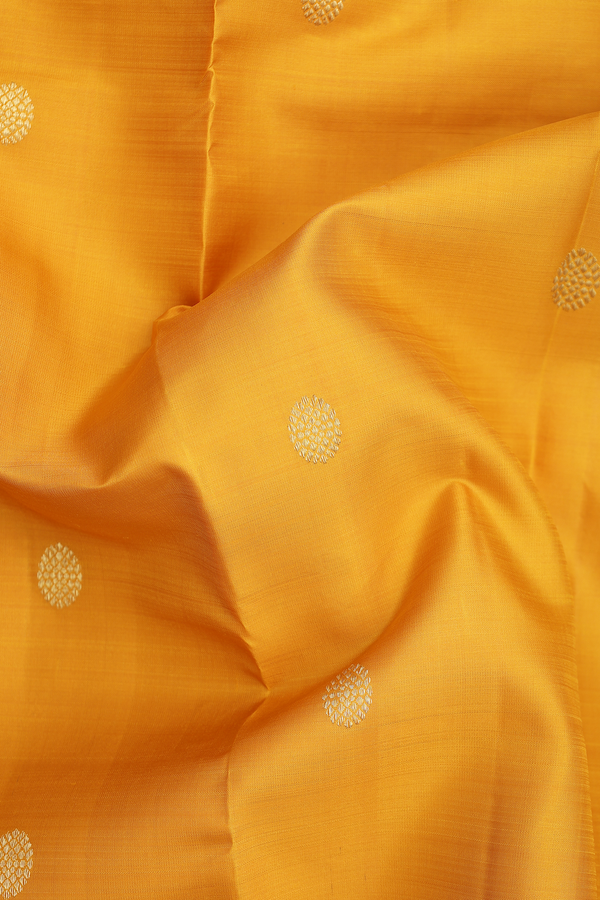Kanchipuram Silk Saree In Saffron Yellow With Chakram Buttas