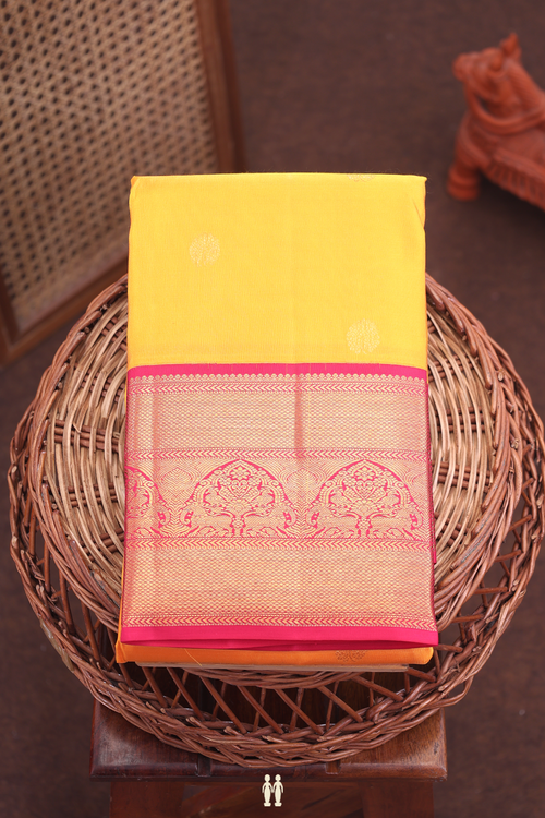 Kanchipuram Silk Saree In Saffron Yellow With Floral Buttas