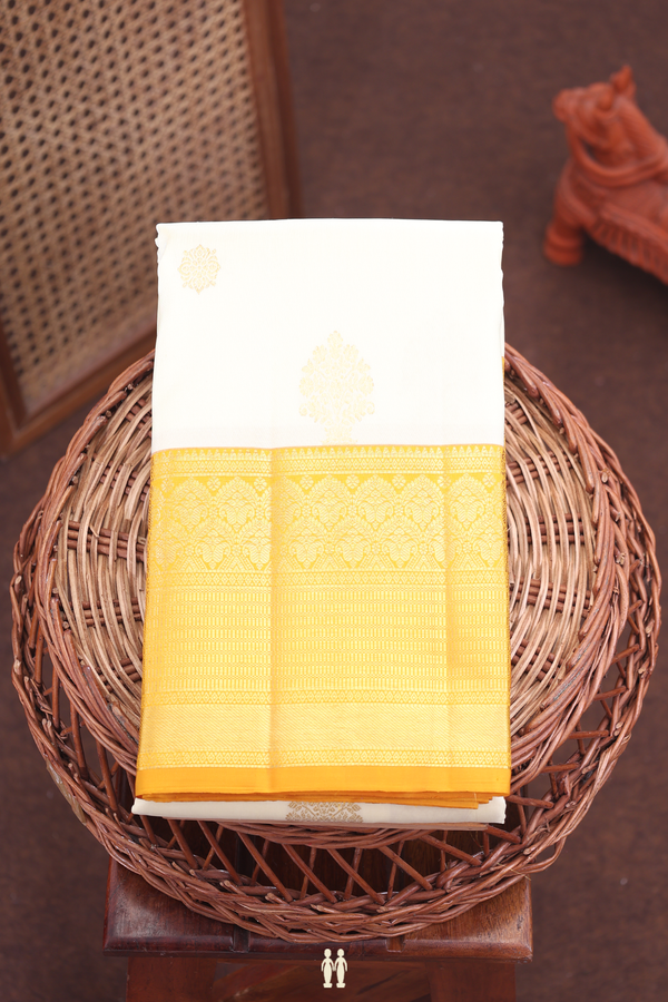 Kanchipuram Silk Saree In Saffron Yellow With Floral Buttas
