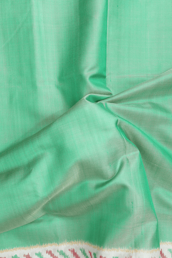 Patola Silk Saree In Plain Green With Contrast Border