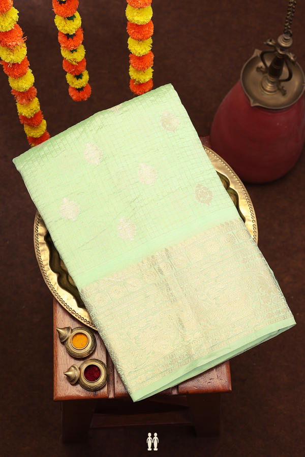 Raw Silk Saree In Mint Green Along Checks With Buttas