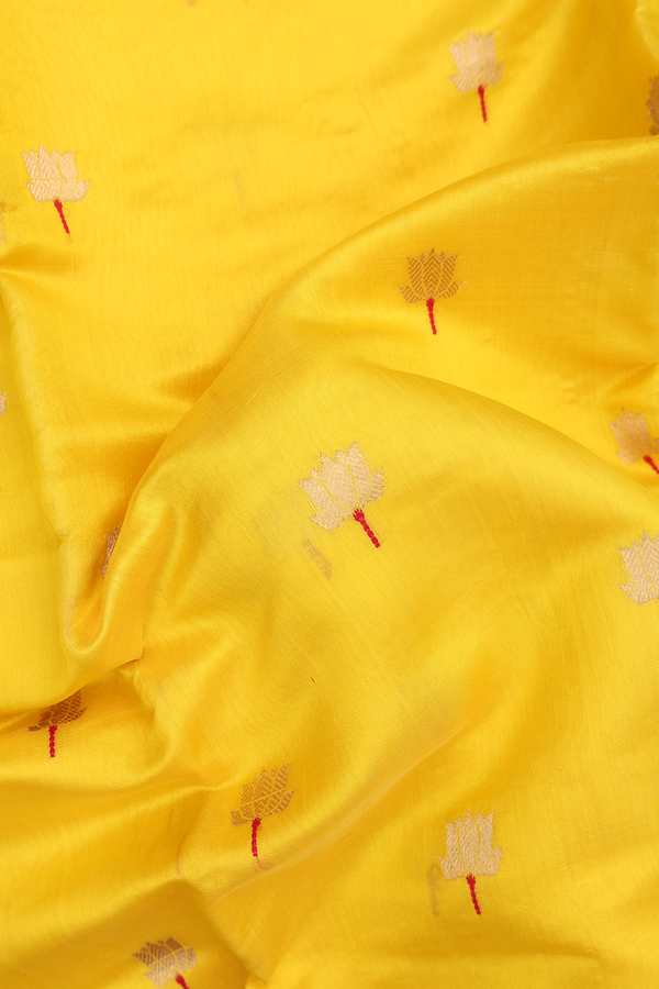 Raw Silk Saree In Saffron Yellow With Floral Buttas