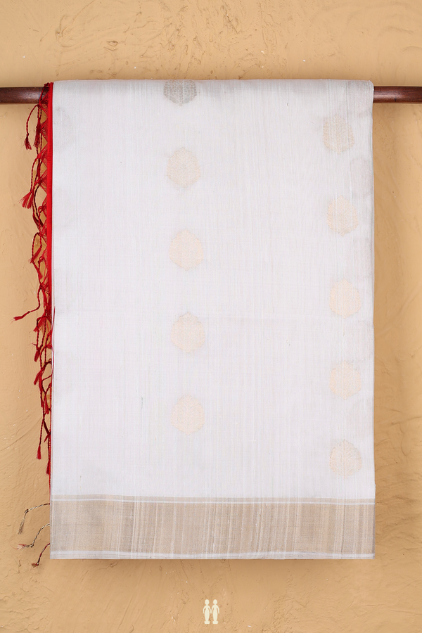 Raw Silk Saree In White With Zari Buttas