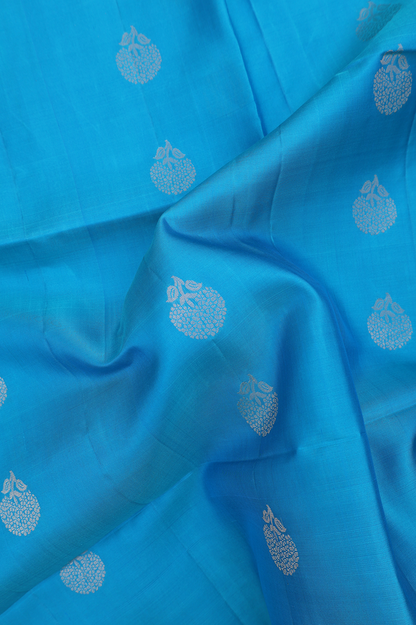 Soft Silk Saree In Blue With Floral Buttas