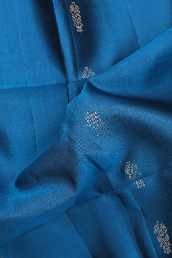 Soft Silk Saree In Teal Blue With Floral Buttas