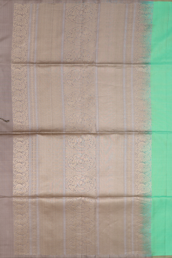 Soft Silk Saree In Green With Peacock Motifs