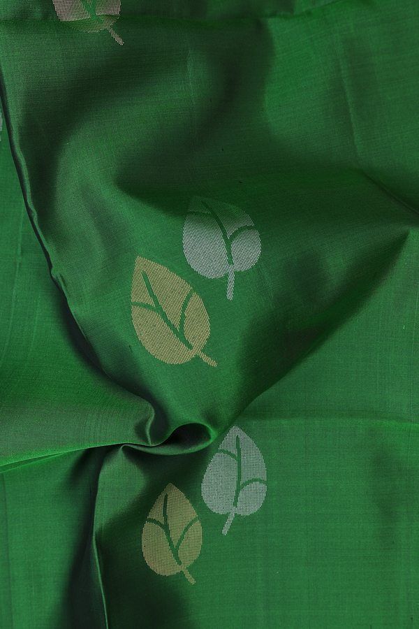 Soft Silk Saree In Leaf Green With Zari Buttas