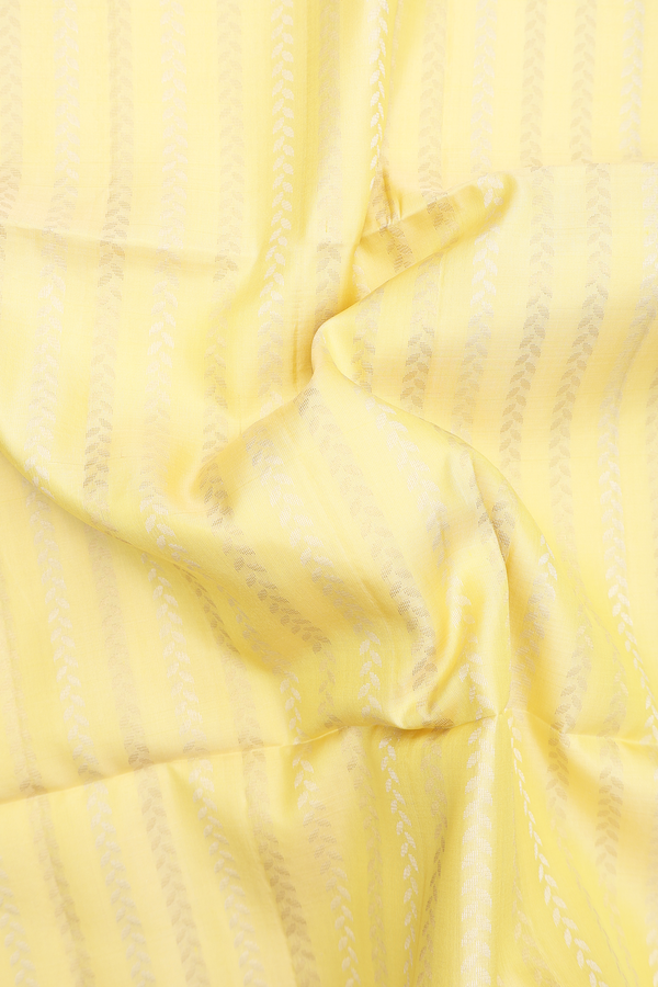 Soft Silk Saree In Pastel Yellow With Stripes Design