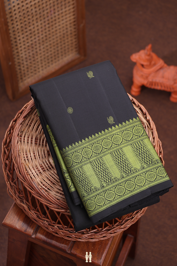 Kanchipuram Silk Saree In Black With Peacock Buttas