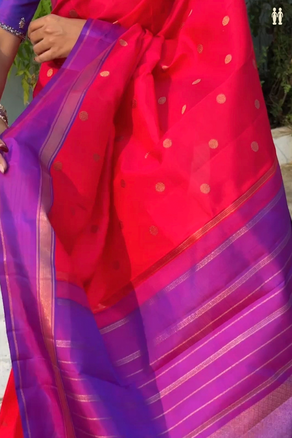 Kanchipuram Silk Saree In Reddish Pink With Chakrm Buttas