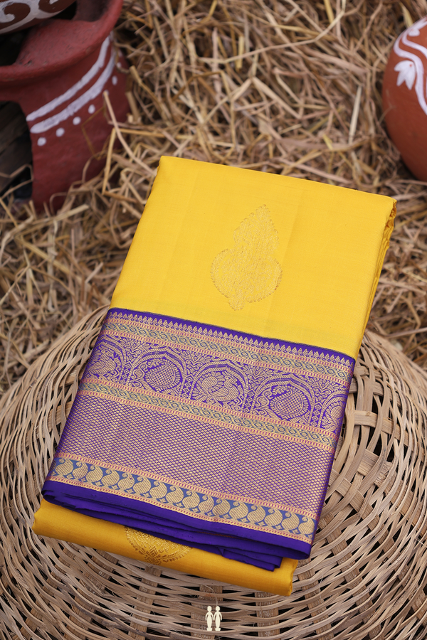 Kanchipuram Silk Saree In Saffron Yellow With Zari Buttas