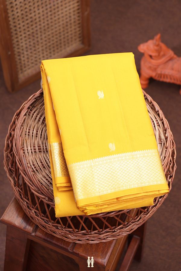 Kanchipuram Silk Saree In Mustard Yellow With Peacock Buttas