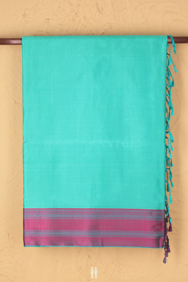 Soft Silk Saree In Shades Of Green With Checks Design