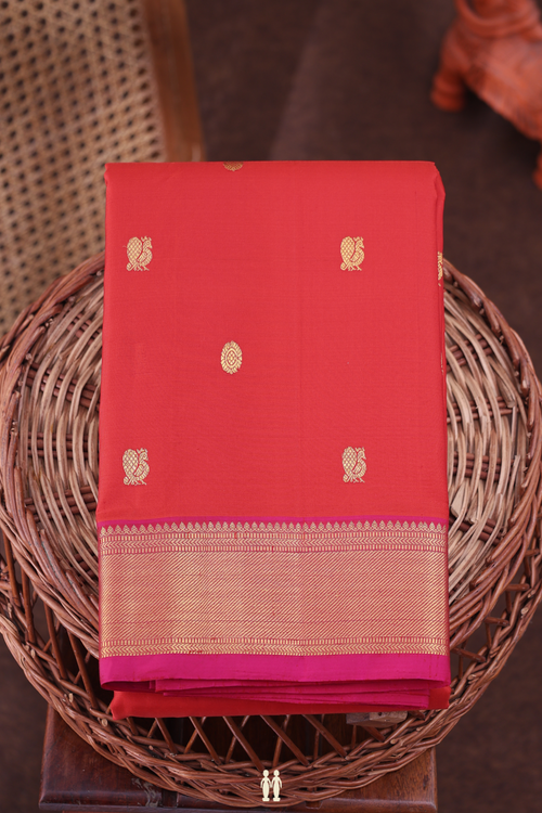 Kanchipuram Silk Saree In Vermillion Red With Peacock Buttas