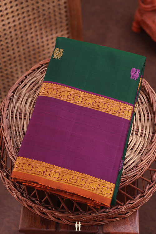 kanchipuram Silk Saree In Forest Green With Peacock Buttas