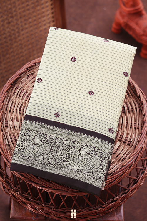 Kanchipuram Silk Saree In White Along Stripes With Buttas