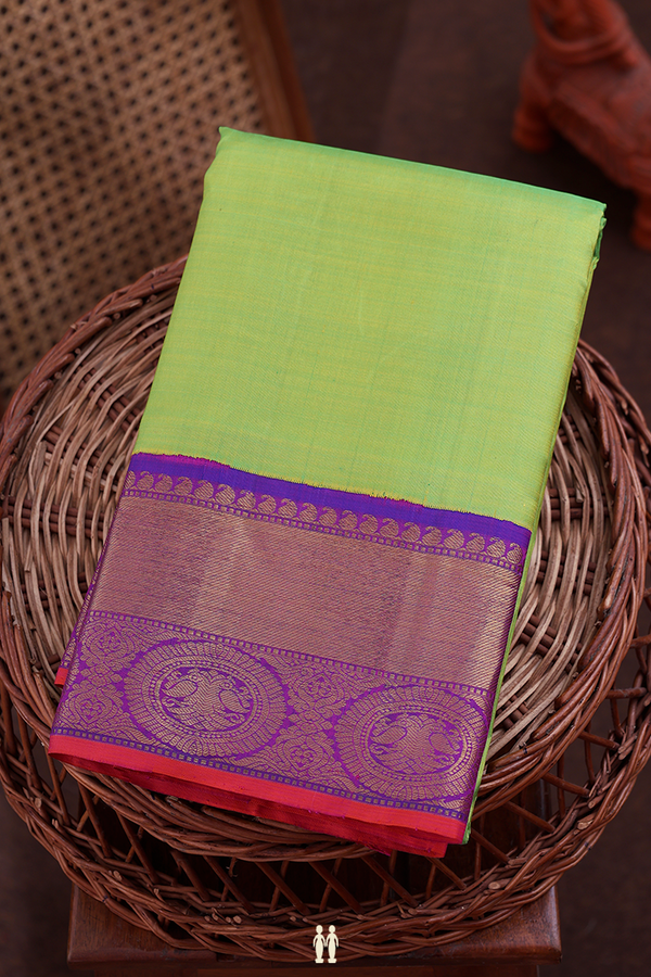 Kanchipuram Silk Saree In Parrot Green With Contrast Border