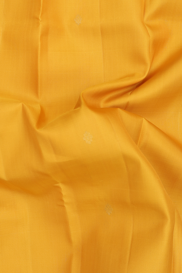 Kanchipuram Silk Saree In Saffron Yellow With Floral Buttas