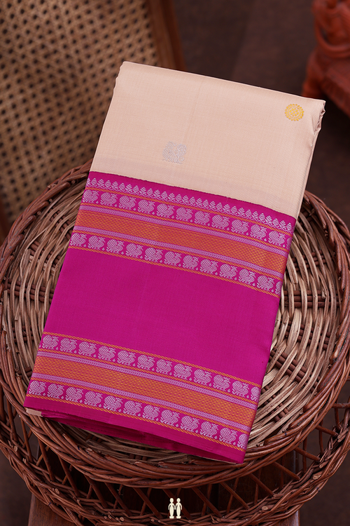 Kanchipuram Silk Saree In Creamy Orange With Peacock Buttas