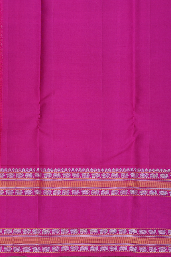 Kanchipuram Silk Saree In Creamy Orange With Peacock Buttas