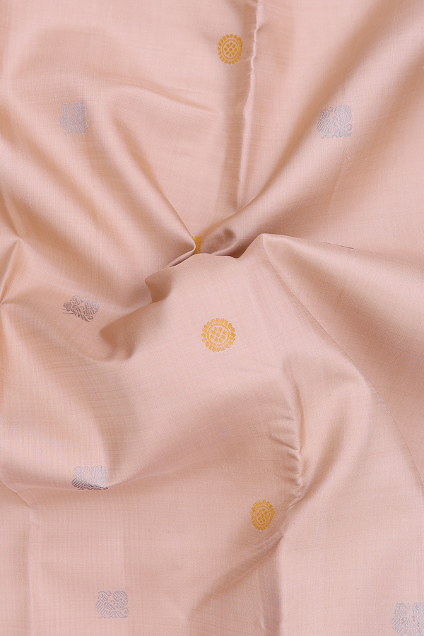 Kanchipuram Silk Saree In Creamy Orange With Peacock Buttas