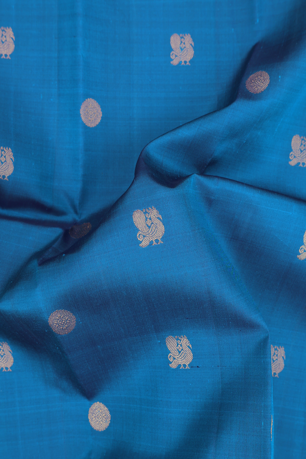 Kanchipuram Silk Saree In Capri Blue With Peacock Buttas