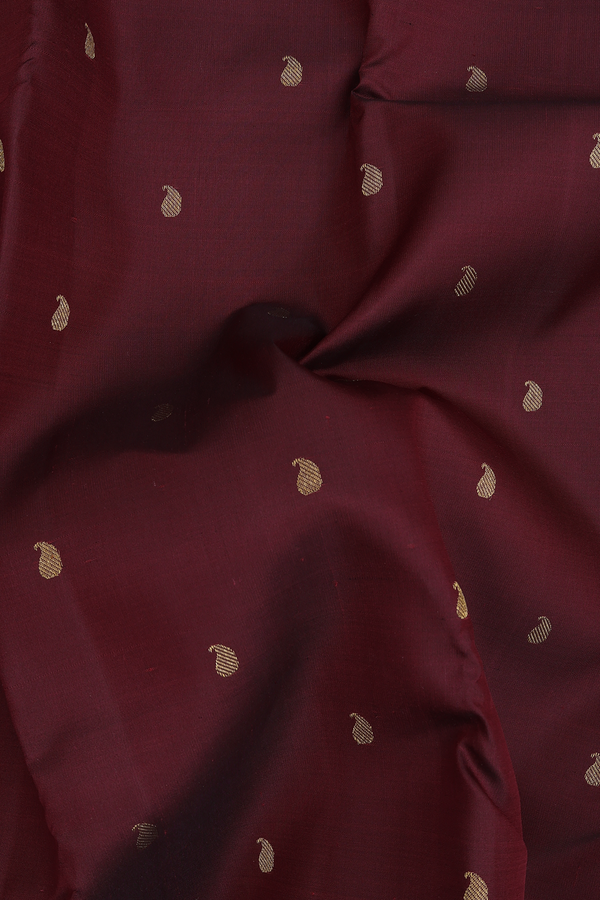 Kanchipuram Silk Saree In Burgundy Red With Paisley Buttis