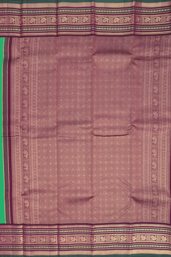 Kanchipuram Silk Saree In Green With Peacock Chakram Buttas