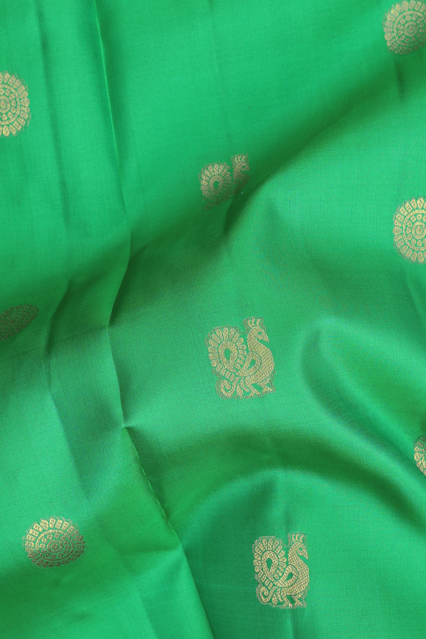 Kanchipuram Silk Saree In Green With Peacock Chakram Buttas