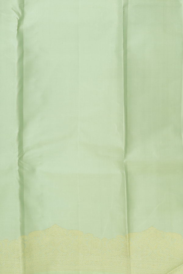 Kanchipuram Silk Saree In Pastel Green With Peacock Buttas