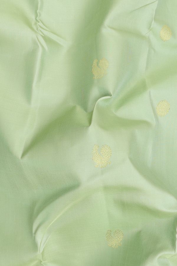 Kanchipuram Silk Saree In Pastel Green With Peacock Buttas