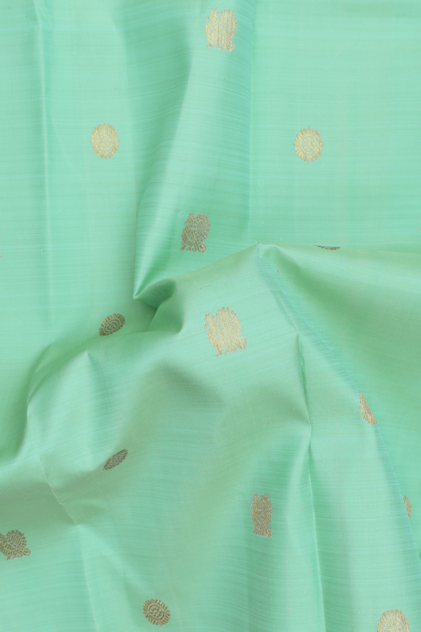 Kanchipuram Silk Saree In Green With Peacock Buttas