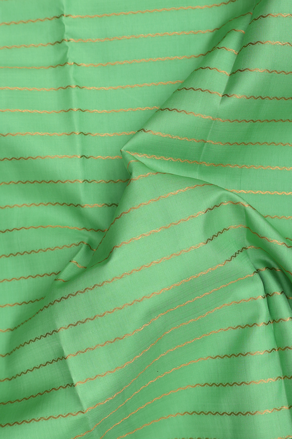 Kanchipuram Silk Saree In Light Green With Stripes Design