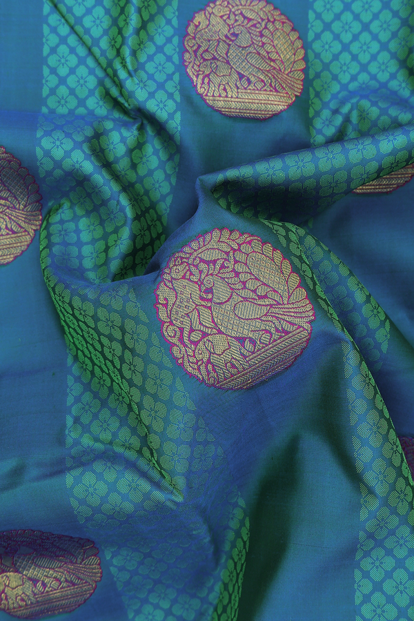Kanchipuram Silk Saree In Teal Blue Along Stripes With Motifs