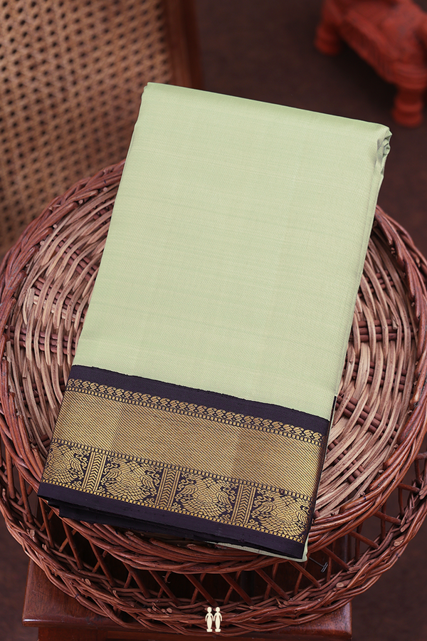 Kanchipuram Silk Saree In Pastel Green With Contrast Border
