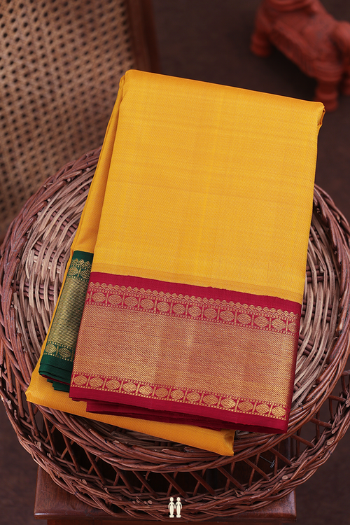 Kanchipuram Silk Saree In Yellow With Ganga Jamuna Border