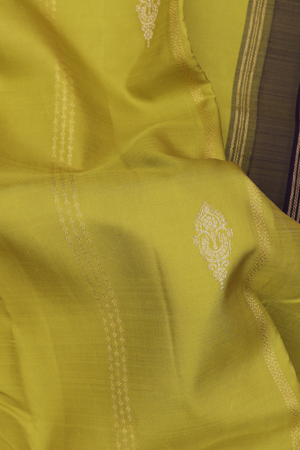 Kanchipuram Silk Saree In Pear Green Along Stripes With Buttas