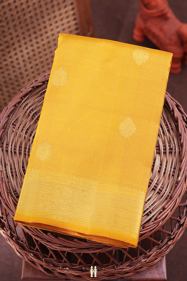 Kanchipuram Silk Saree In Yellow Along Checks With Buttas