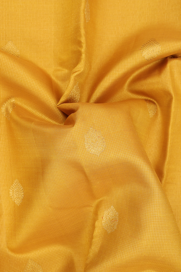 Kanchipuram Silk Saree In Yellow Along Checks With Buttas