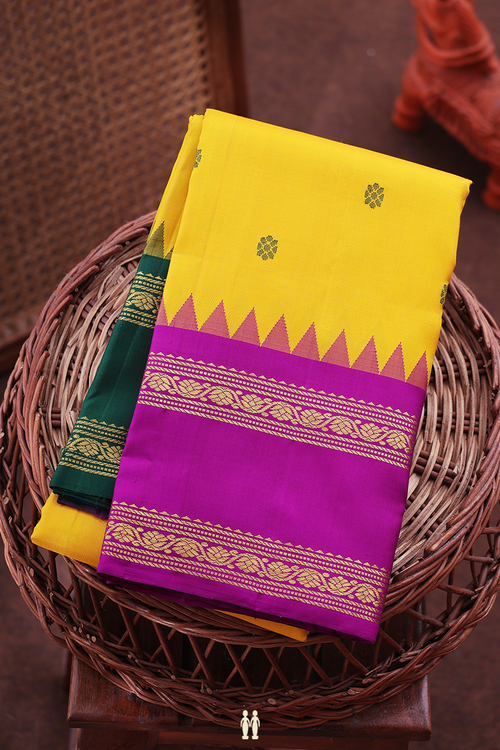 Kanchipuram Silk Saree In Saffron Yellow With Floral Buttas