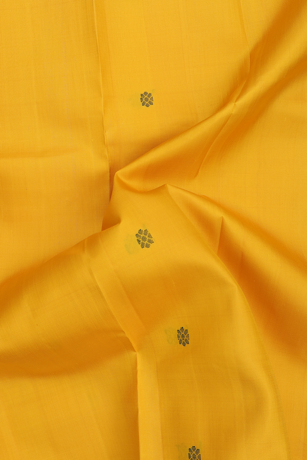 Kanchipuram Silk Saree In Saffron Yellow With Floral Buttas