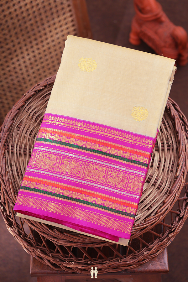 Kanchipuram Silk Saree In Cream Color With Peacock Buttas