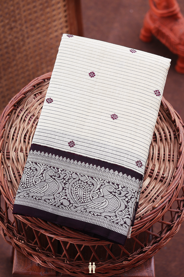 Kanchipuram Silk Saree In White Along Stripes With Buttas