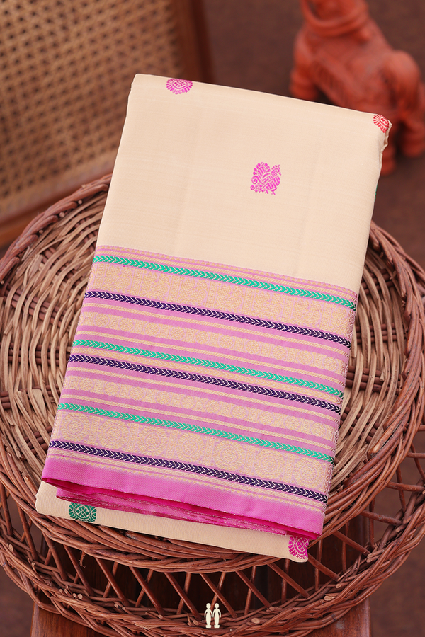 Kanchipuram Silk Saree In Cream Color With Peacock Buttas