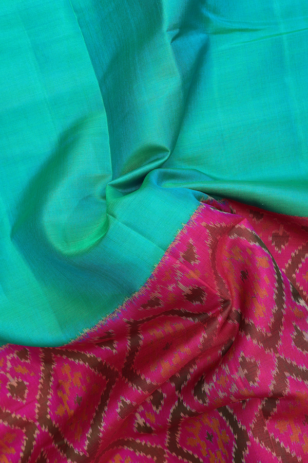 Patola Silk Saree In Peacock Green With Diamond Border