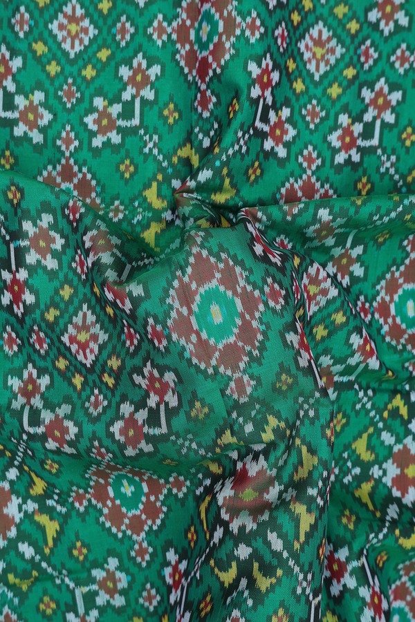 Patola Silk Saree In Green With Ikat Design