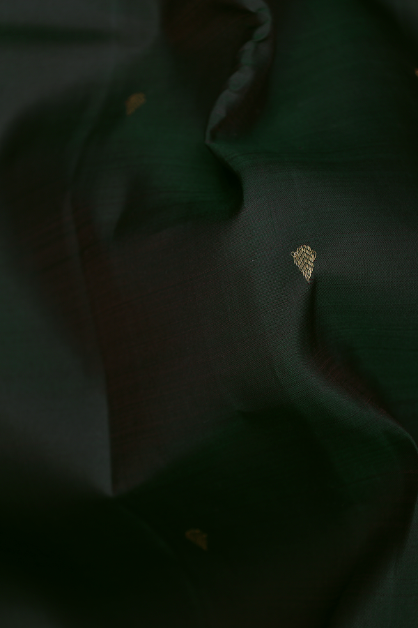 Kanchipuram Silk Saree In Bottle Green With Thilagam Buttis
